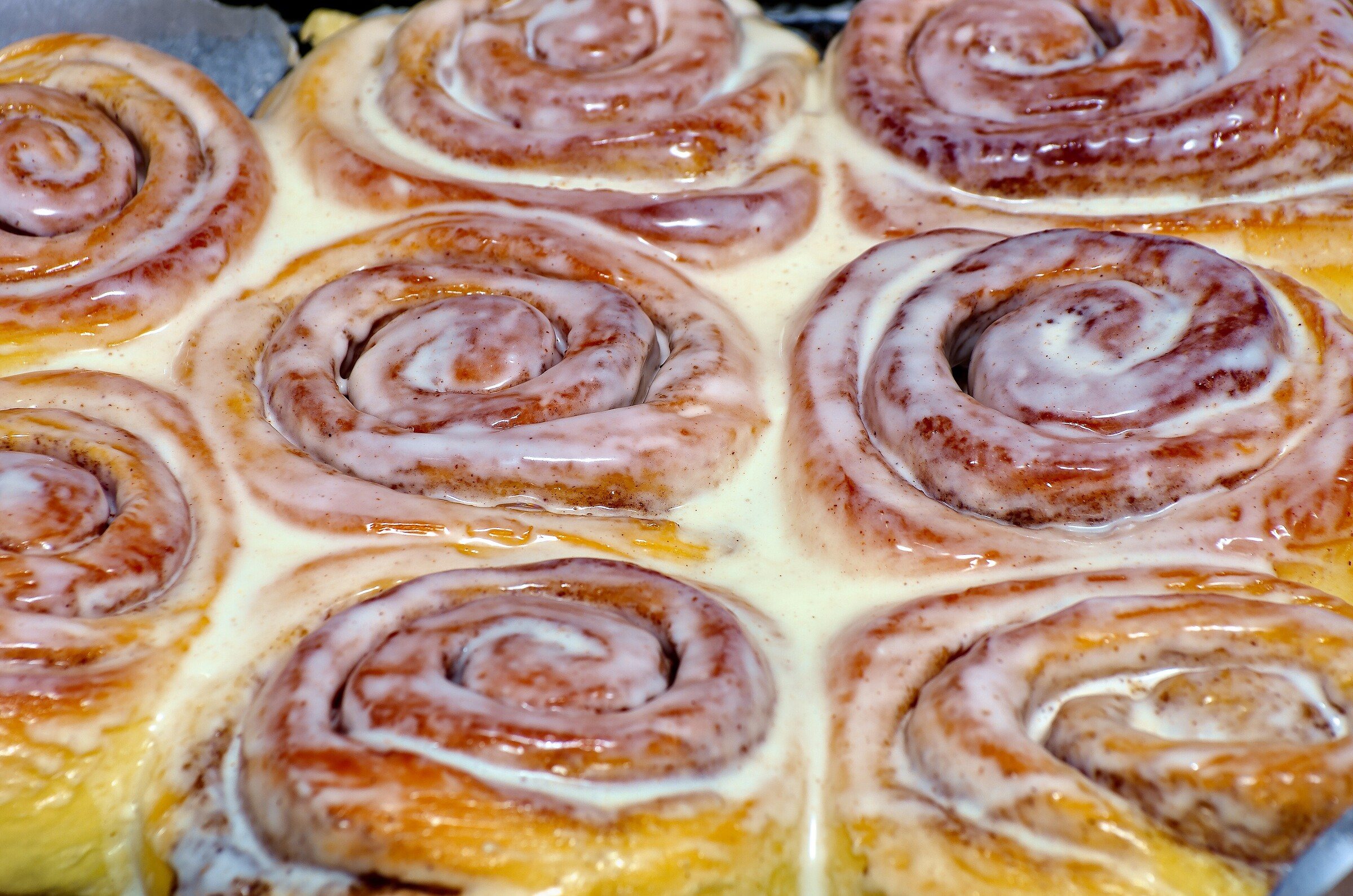 A pan of iced cinnamon rolls